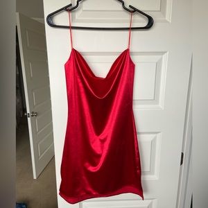 Red satin mini slip dress with small leg slit on the side